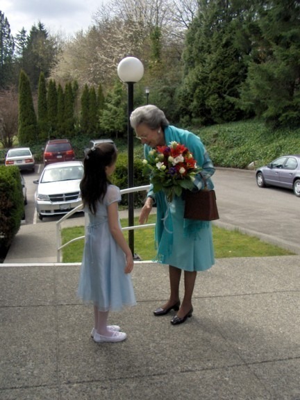 Justine presents flowers to Princess Benedikte in front of our church