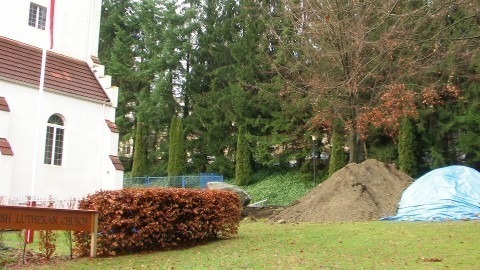 Piles of dirt on the front lawn